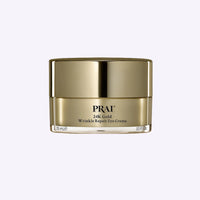 PRAI Beauty 24K Gold Wrinkle Repair Eye Creme 15ml tube with gold and white packaging on white background