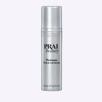 Compact PRAI Beauty Platinum Firm & Lift Serum 15ml bottle featuring elegant silver top and minimalist label.
