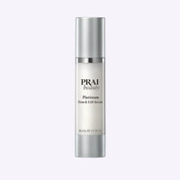 Bottle of PRAI Beauty Platinum Firm & Lift Serum 50ml with silver and white packaging on white background.