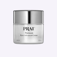 Jar of Platinum Rare Advanced Creme by PRAI Beauty with silver and blue packaging on white background