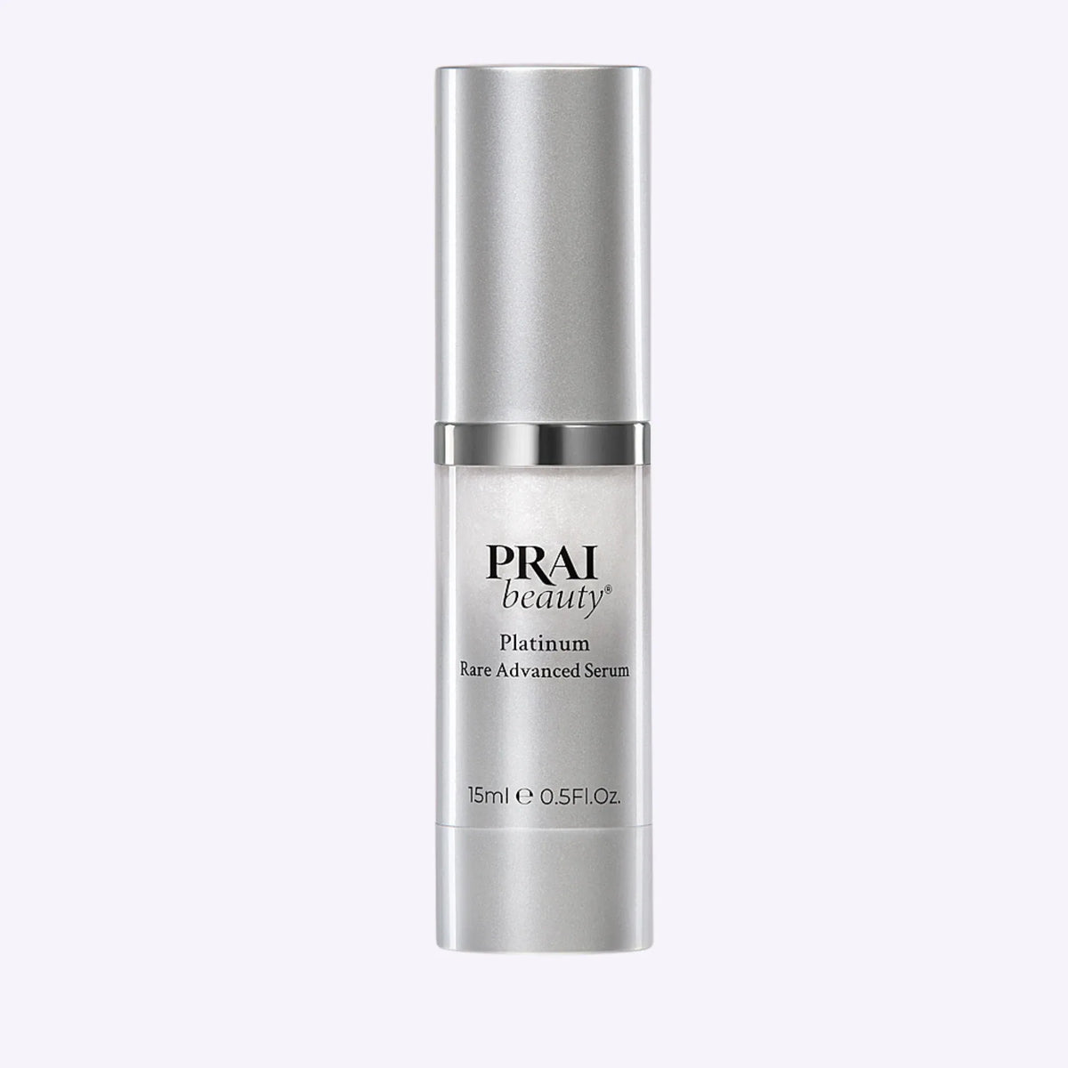 Smaller 15ml bottle of PRAI Beauty Platinum Rare Advanced Serum with sleek silver and white packaging.