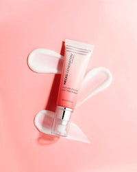 Close-up of Necks-Generation Future-Proof Day Treatment bottle beside its branded box on a white surface
