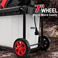 Electric chipper positioned on a yard with wood branches to demonstrate use.