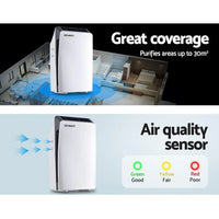 White Devanti air purifier placed on wooden surface in bright room setting.