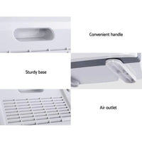 Compact white air purifier with carbon filter and ioniser features displayed.