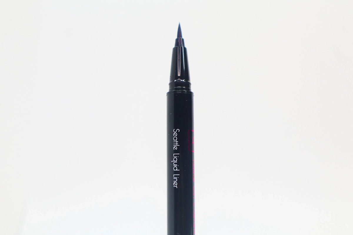 Close-up of Queen Anne Liquid Liner packaging with royal blue liquid liner and product name on a white background.