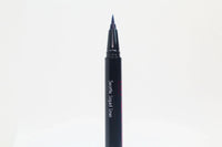 Close-up of Queen Anne Liquid Liner packaging with royal blue liquid liner and product name on a white background.