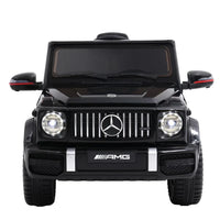 Close-up of black Mercedes-Benz AMG G63 kids ride on car dashboard and steering wheel