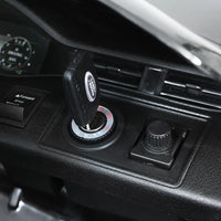 Interior view of kids ride on car highlighting the steering wheel and dashboard controls.
