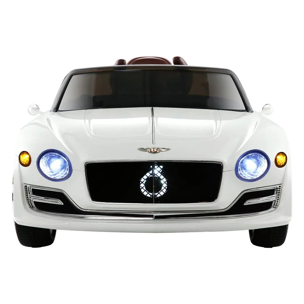 Close-up on the white ride on car’s front grille and Bentley logo with sleek design accents.