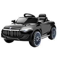 Front view of black electric kids ride-on car with sleek design and headlights on.
