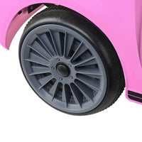 Pink electric kids' car shown with remote control feature in hand.