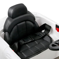 Interior shot of kids ride on car featuring detailed dashboard and steering wheel.