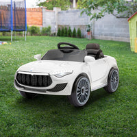 White kids ride on car angled rear view, highlighting rear lights and sleek body.
