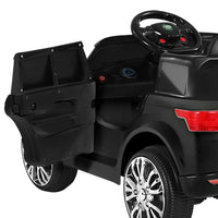 Side profile of sleek black ride-on car designed for children with textured seats.