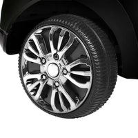 Kids electric ride-on car in black with visible pedals and rugged wheels for outdoor fun.