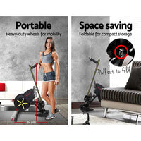 Close-up of molded seat and foot pedals with straps on rowing exercise machine.