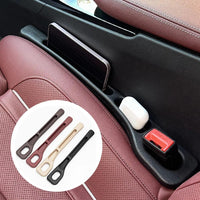 Black car seat gap filler strip placed between seat and center console.