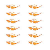 A collection of twelve colorful flame-shaped sunglasses with gradient lenses, arranged on a white surface.