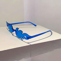 A set of 12 colorful flame-shaped sunglasses arranged stylishly on a white background.