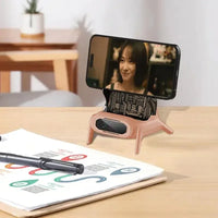 Wireless charger shaped like a chair with phone screen showing active use.
