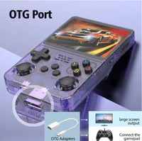 Handheld game console resting on wooden surface with screen and controls visible