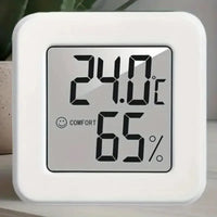 Compact indoor temperature and humidity meter showing digital display with temperature and humidity readings.