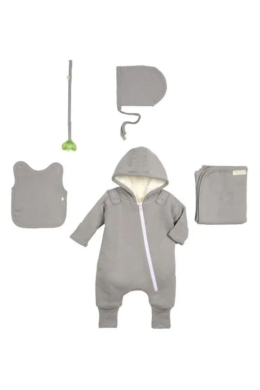 Baby crawling on floor in soft gray jumpsuit and matching bib, hand and feet covers visible.