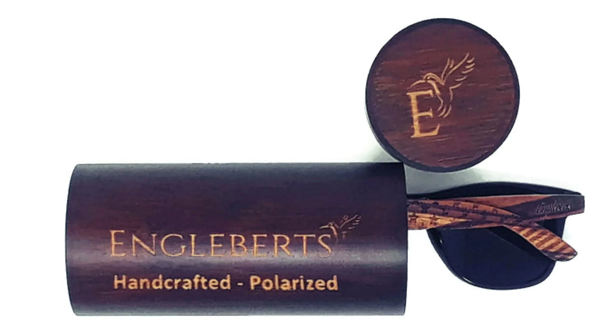 Detailed back shot of sunglasses showing artisan engraved stars on natural wood frame