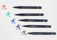 Swatches of Queen Anne Liquid Liner showing vibrant royal blue lines on light skin.