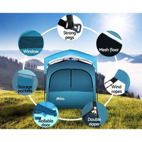 Weisshorn portable outdoor shower tent anchored firmly with ropes and pegs on a grassy campsite.