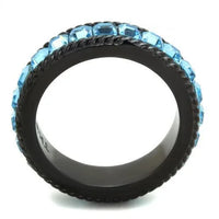 Ring displayed flat showing smooth black ion plating and sparkling sea blue crystal in center.