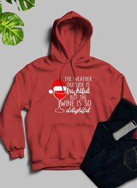 Front view of a grey hoodie with snowy mountain and text design, cozy fleece lining visible inside hood.