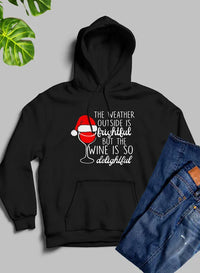 Model wearing grey hoodie outdoors featuring winter mountain design and relaxed fit.