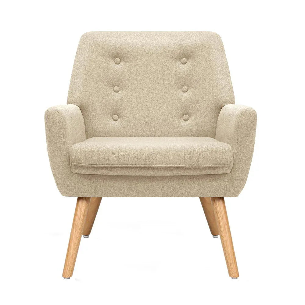 Close-up of beige fabric upholstery with tufted button design on the armchair’s backrest.