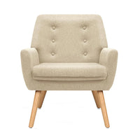 Close-up of beige fabric upholstery with tufted button design on the armchair’s backrest.