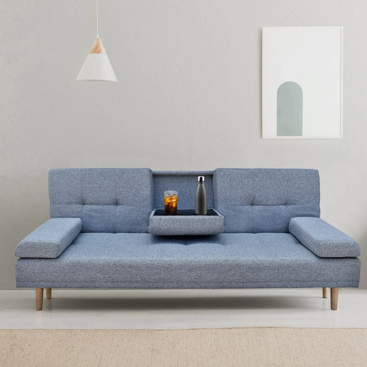 Side view of grey sofa bed showing removable cushions and wooden legs.