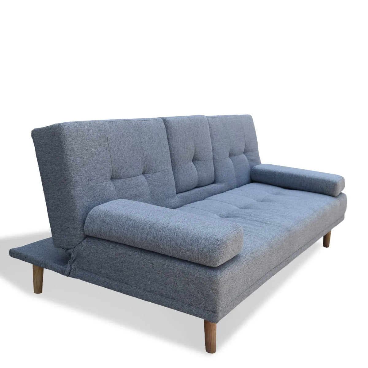 Grey sofa bed armrest detail and smooth fabric texture under natural light.