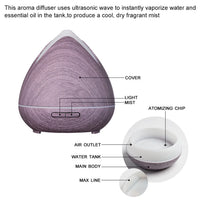 Side view of white ultrasonic diffuser showing minimalist design and mist output.