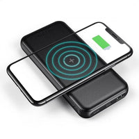 Black Choetech B650-CC power bank with wireless charging pad angled on white background.