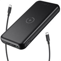 Close-up of the black power bank displaying its USB-C and charging ports.