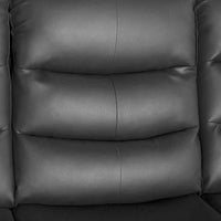 Close-up of reclining black faux leather sofa seat showing quilted design and cushioned comfort.