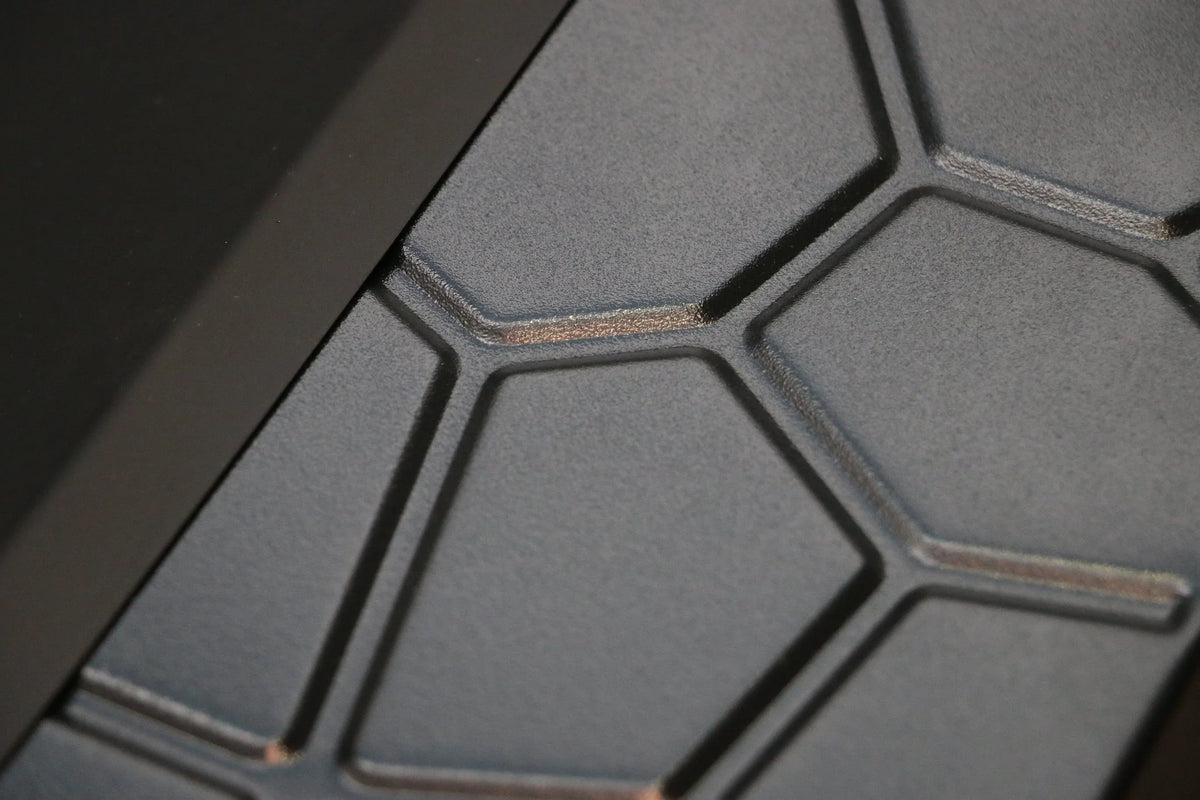 Side view of square metal fire pit highlighting its sturdy support posts.