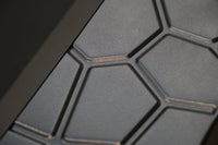 Side view of square metal fire pit highlighting its sturdy support posts.