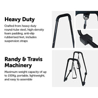 Rear angle of black steel parallette stand used for dips and push-ups at home gym.