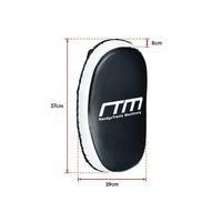Curved punch shield held by trainer during MMA kickboxing practice