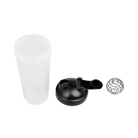 Protein shaker bottle with purple lid and white mixer ball on a plain white background