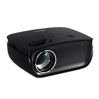 Black Devanti mini video projector showing lens and ventilation on side, angled top view.