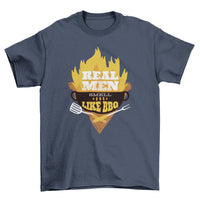 Black T-shirt with a BBQ grill illustration, flames, and text 'Real Men smell like bbq' in white.