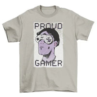 Flat lay of Proud Gamer T-shirt with illustrated man wearing console controller sunglasses and text